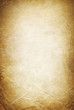 Vintage folded and torn old paper. Grunge classic background