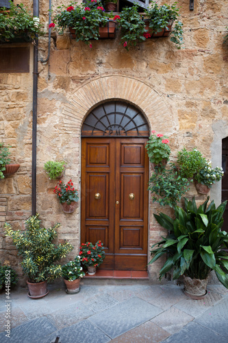 Photo: wooden residential doorway in Tuscany. Italy wooden residential doorway in Tuscany. Italy