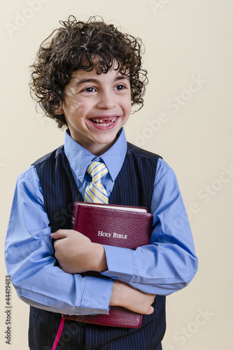 Photo: Young Boy Holding a Bible Young Boy Holding a Bible
