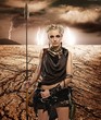 Woman with a spear  in a desert