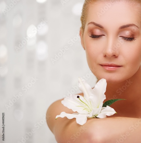 Beautiful woman with lilly flower portrait