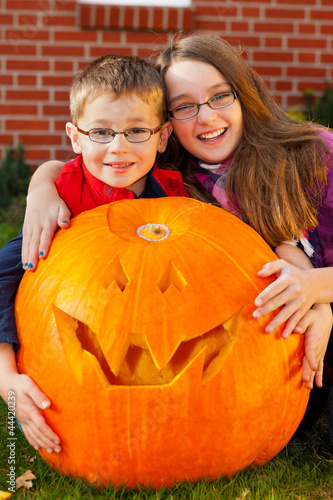 Photo: children proud of their jack-o-lantern children proud of their jack-o-lantern