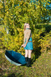 Photo: young woman posing near a tree young woman posing near a tree