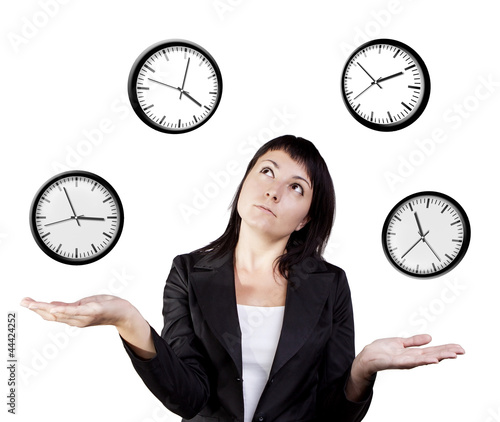 Photo: Businesswoman juggling clocks. Time Juggling Act. Businesswoman juggling clocks. Time Juggling Act.