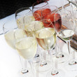 Wine glasses filled with chilled white and rose wine