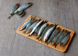 Fresh sardines on wooden board