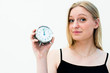 woman holding a clock
