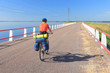 Cyclist on a causeway, road between Saaremaa and Muhu.