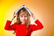Little girl with books on white