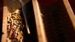 Incense stick in a wooden holder with red silk background, artit