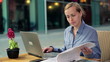Video: Happy businesswoman with laptop and documents in the city Happy businesswoman with laptop and documents in the city