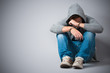 Arrested teenager with handcuffs on his hands