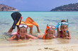 Children with equipment for diving in the shallow sea