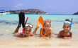 Children with equipment for diving in the shallow sea