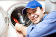 Technician repairing a washing machine