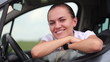 Video: Portrait of young smiling woman sitting in the car Portrait of young smiling woman sitting in the car