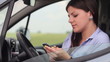 Video: Young attractive woman using mobile phone in the car Young attractive woman using mobile phone in the car