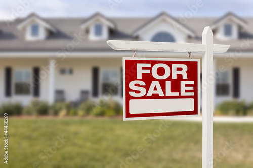 Photo: Red For Sale Real Estate Sign and New Home Red For Sale Real Estate Sign and New Home