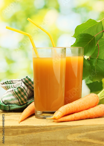 Photo: glasses of carrot juice and fresh carrots glasses of carrot juice and fresh carrots