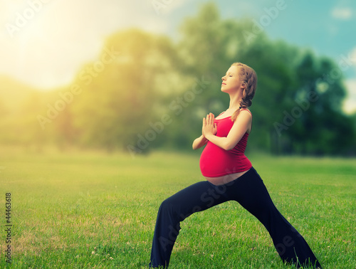 Photo: healthy pregnant woman doing yoga in nature healthy pregnant woman doing yoga in nature