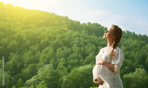 Photo: pregnant woman relaxing and enjoying life in nature pregnant woman relaxing and enjoying life in nature