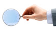 Photo: Magnifying glass in hand isolated over white background Magnifying glass in hand isolated over white background