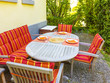 tableclothes at a teak table in the garden