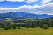 A view of The Tatra Mountains and village in summer, Poland.