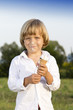 Foto: Young cute boy eating a tasty ice cream Young cute boy eating a tasty ice cream