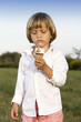 Foto: Young cute boy eating a tasty ice cream Young cute boy eating a tasty ice cream