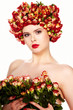 Photo: Portrait of young beautiful woman with roses in hair, on white b Portrait of young beautiful woman with roses in hair, on white b