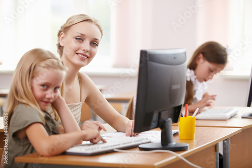 Photo: Little girl at school class Little girl at school class