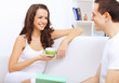Young woman having cup of tea at home