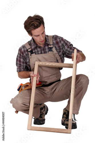 Photo: Furniture maker constructing wooden frame Furniture maker constructing wooden frame