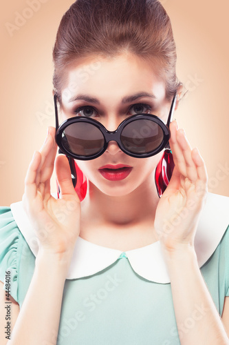 Photo: Surprised girl in round sunglasses Surprised girl in round sunglasses