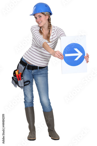 Photo: Woman with a one way sign Woman with a one way sign