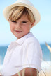 little boy posing on the beach