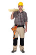 Carpenter carrying planks of wood