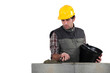 Mason smoothing cement onto unfinished wall