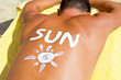 boy tanning with sunscreen
