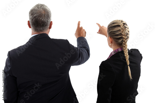 Photo: Business people pointing at empty copyspace Business people pointing at empty copyspace