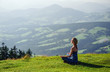 Young woman meditating outdoors