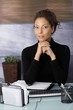 Portrait of attractive businesswoman at desk