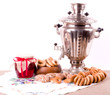 Samovar, old Russian tea kettle with bagels and jam