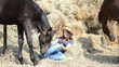 Video: Girl and her horses resting near a haystack Girl and her horses resting near a haystack