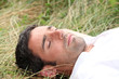 man sleeping on the grass