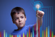 Foto: Child pointing to colorful graph - with copy space Child pointing to colorful graph - with copy space