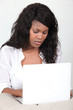Black woman using laptop computer