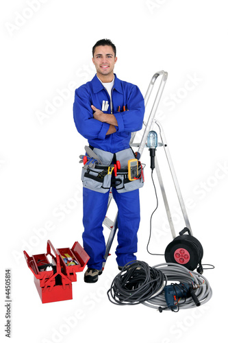 Photo: Confident electrician, studio shot Confident electrician, studio shot