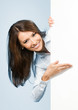 Photo: Businesswoman showing signboard, over blue Businesswoman showing signboard, over blue